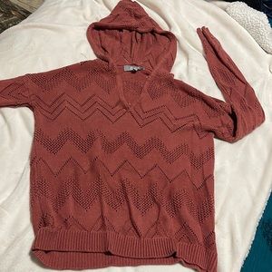 Long sleeved hooded sweater shirt.